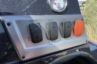 Slide: The Image of Control panel of a 2025 Nitro Z19 boat with switches and gauge. - 7