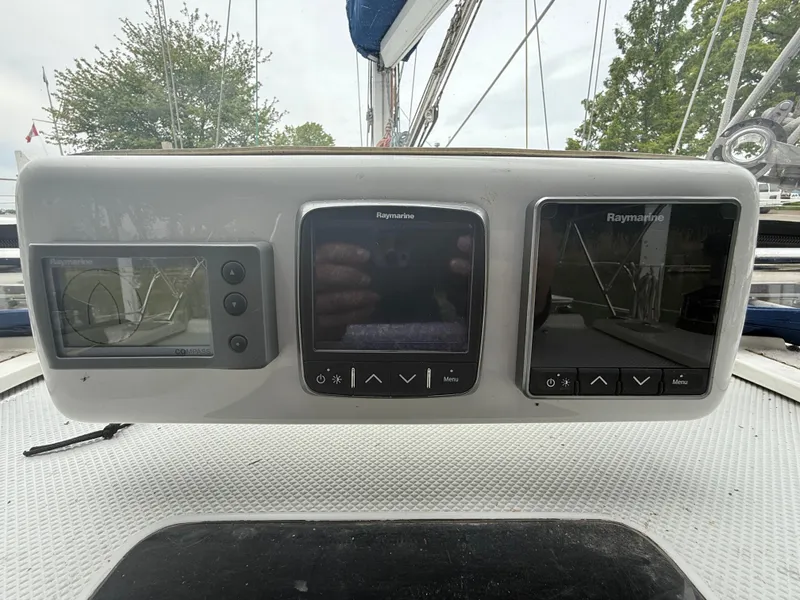 Slide: The Image of Control panel of a 2001 Catalina 42 MkII sailboat with Raymarine displays. - 14