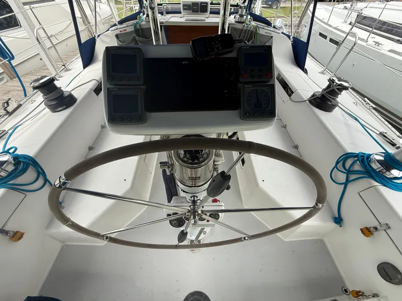 Slide: The Image of Cockpit of 2001 Catalina 42 MkII sailboat with steering wheel and navigation instruments. - 23