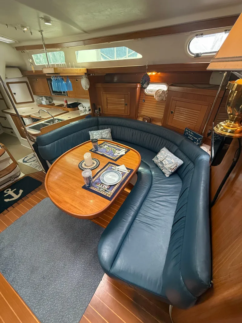 Slide: The Image of Interior of 2001 Catalina 42 MkII sailboat with cozy seating and dining area. - 27