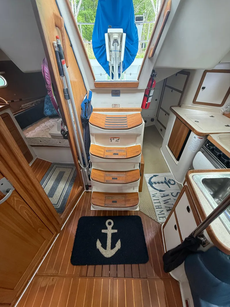 Slide: The Image of Interior of 2001 Catalina 42 MkII sailboat with wooden flooring and nautical decor. - 30