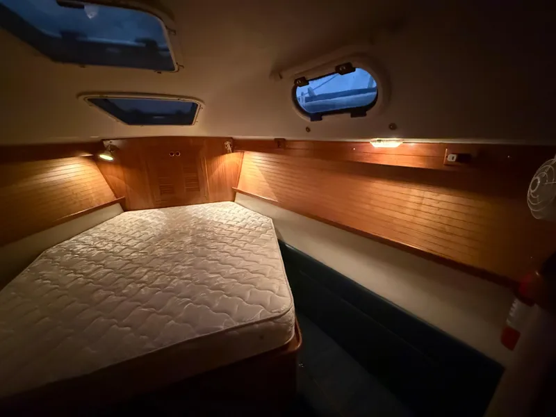 Slide: The Image of Cozy cabin interior of 2001 Catalina 42 MkII sailboat with wooden accents and mattress. - 35