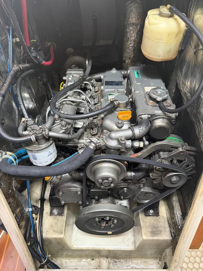 Slide: The Image of Engine compartment of a 2001 Catalina 42 MkII sailboat, showcasing detailed mechanical components. - 40