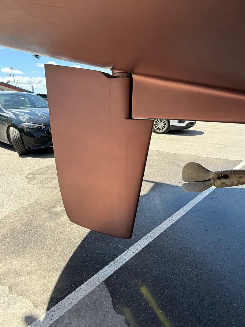 Slide: The Image of 2001 Catalina 42 MkII rudder and propeller in a parking lot. - 44