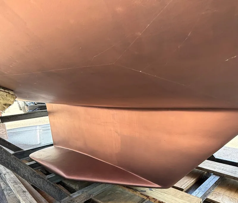 Slide: The Image of 2001 Catalina 42 MkII sailboat keel on display in a boatyard. - 45