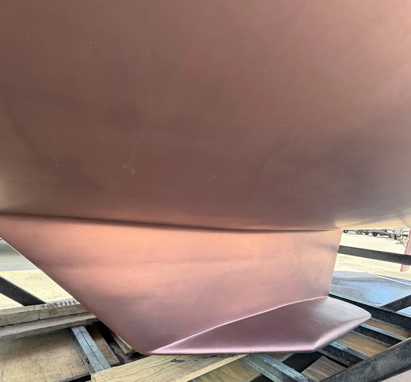 Slide: The Image of Close-up of a 2001 Catalina 42 MkII sailboat keel on a trailer. - 46