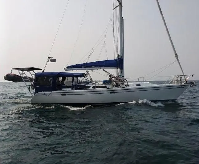 Slide: The Image of 2001 Catalina 42 MkII sailboat cruising on open water, side view. - 49