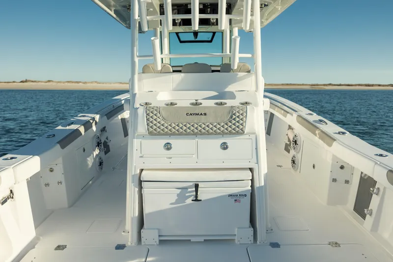 Slide: The Image of 2025 Caymas 34 CT boat interior on calm water, showcasing sleek design and spacious layout. - 11