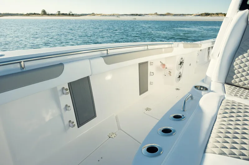Slide: The Image of 2025 Caymas 34 CT boat interior with ocean view, featuring sleek design and seating. - 25