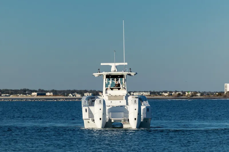 Slide: The Image of 2025 Caymas 34 CT boat cruising on open water. - 5