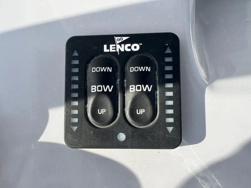 Slide: The Image of Lenco trim tab control panel on 2023 Bayliner Trophy 24 CC boat. - 17