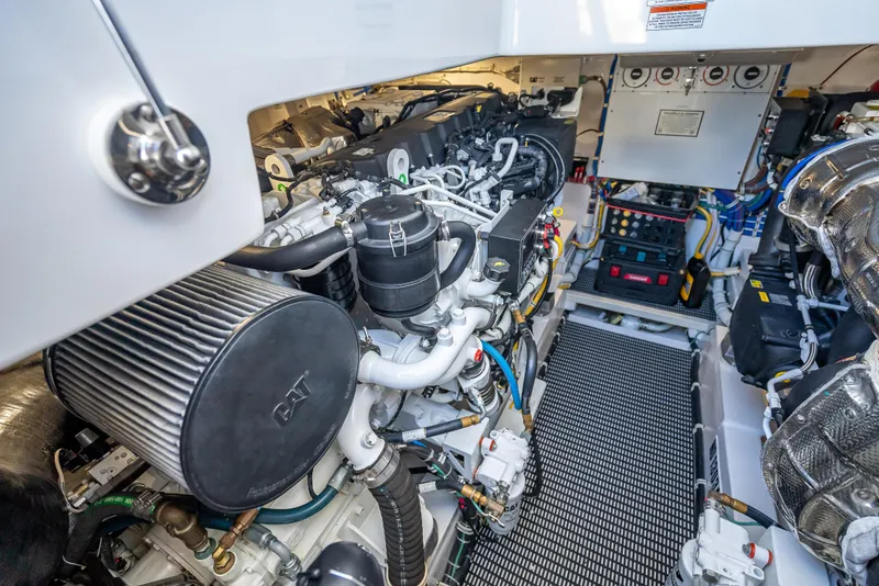 Slide: The Image of Engine room of 2020 Hatteras GT45X yacht, showcasing CAT machinery and components. - 26
