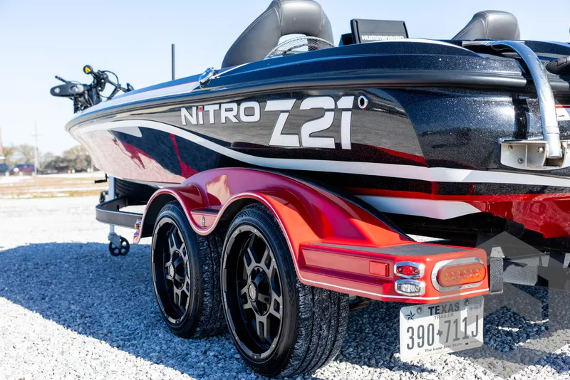 Slide: The Image of 2017 Nitro Z21 Z-PRO boat on trailer, featuring sleek design and dual wheels. - 22