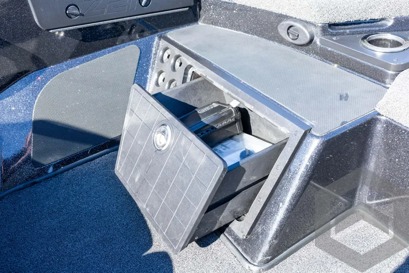 Slide: The Image of Storage compartment in 2017 Nitro Z21 Z-PRO Package boat, featuring secure latch and organized interior. - 42