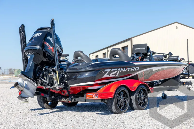 Slide: The Image of 2017 Nitro Z21 Z-PRO Package boat with dual engines on a trailer. - 5
