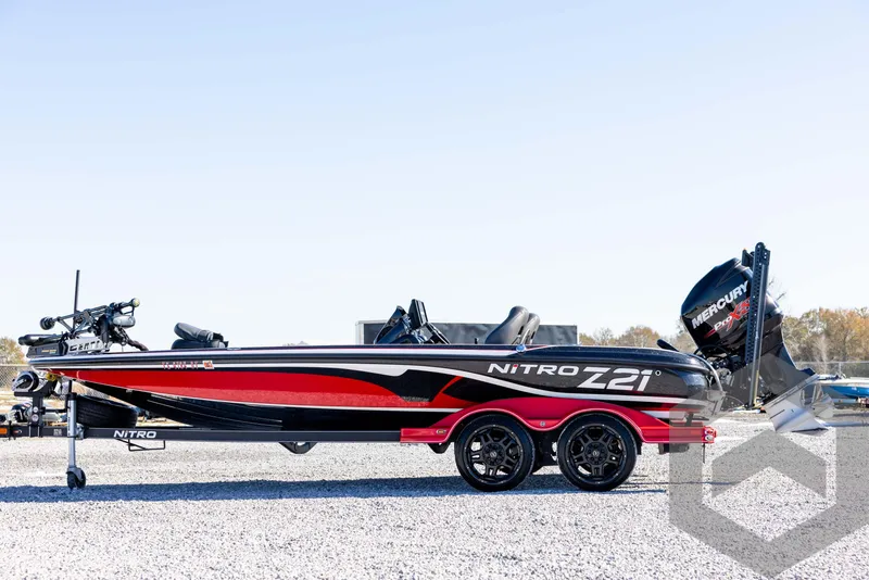 Slide: The Image of 2017 Nitro Z21 Z-PRO Package boat, side view, on gravel surface. - 8