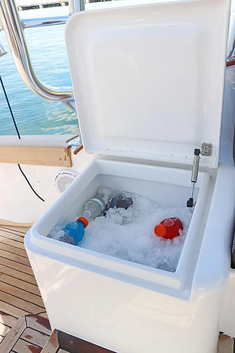 Slide: The Image of Open cooler with drinks on ice aboard 1997 Gamefisherman 34 Express boat. - 14
