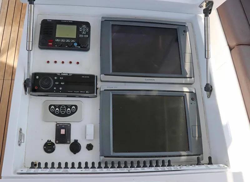 Slide: The Image of Control panel of a 1997 Gamefisherman 34 Express boat with navigation equipment. - 17