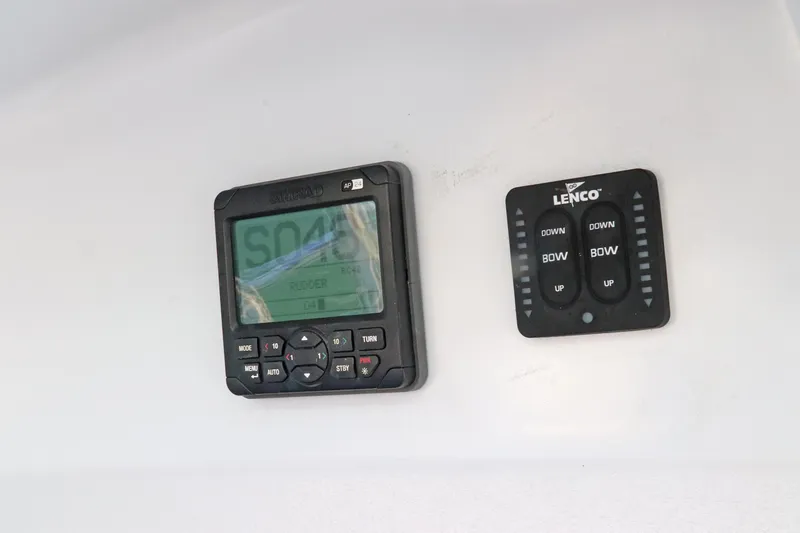 Slide: The Image of Control panel on a 1997 Gamefisherman 34 Express boat dashboard. - 20