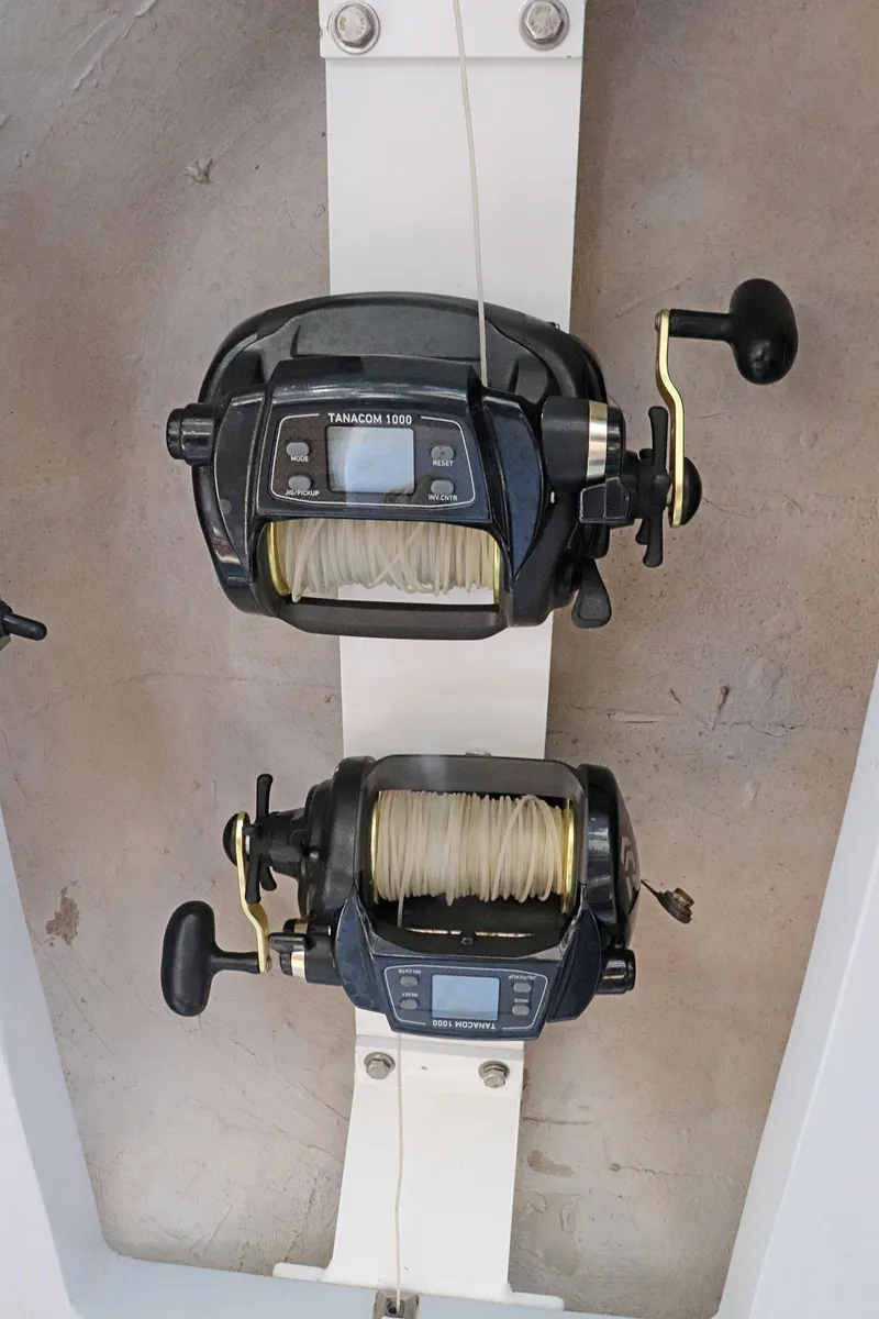 Slide: The Image of Fishing reels on a 1997 Gamefisherman 34 Express boat. - 21