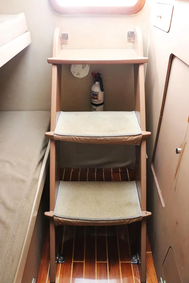 Slide: The Image of Interior of 1997 Gamefisherman 34 Express with wooden steps and fire extinguisher. - 27