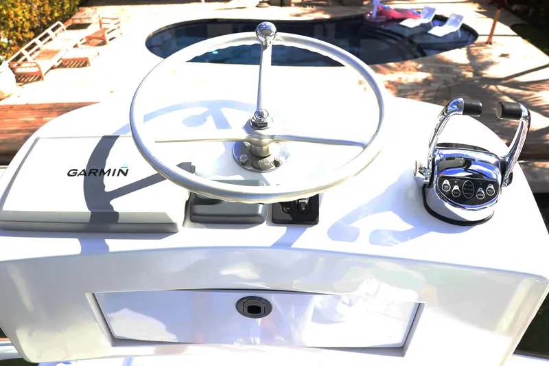 Slide: The Image of 1997 Gamefisherman 34 Express helm with Garmin navigation and steering wheel. - 35