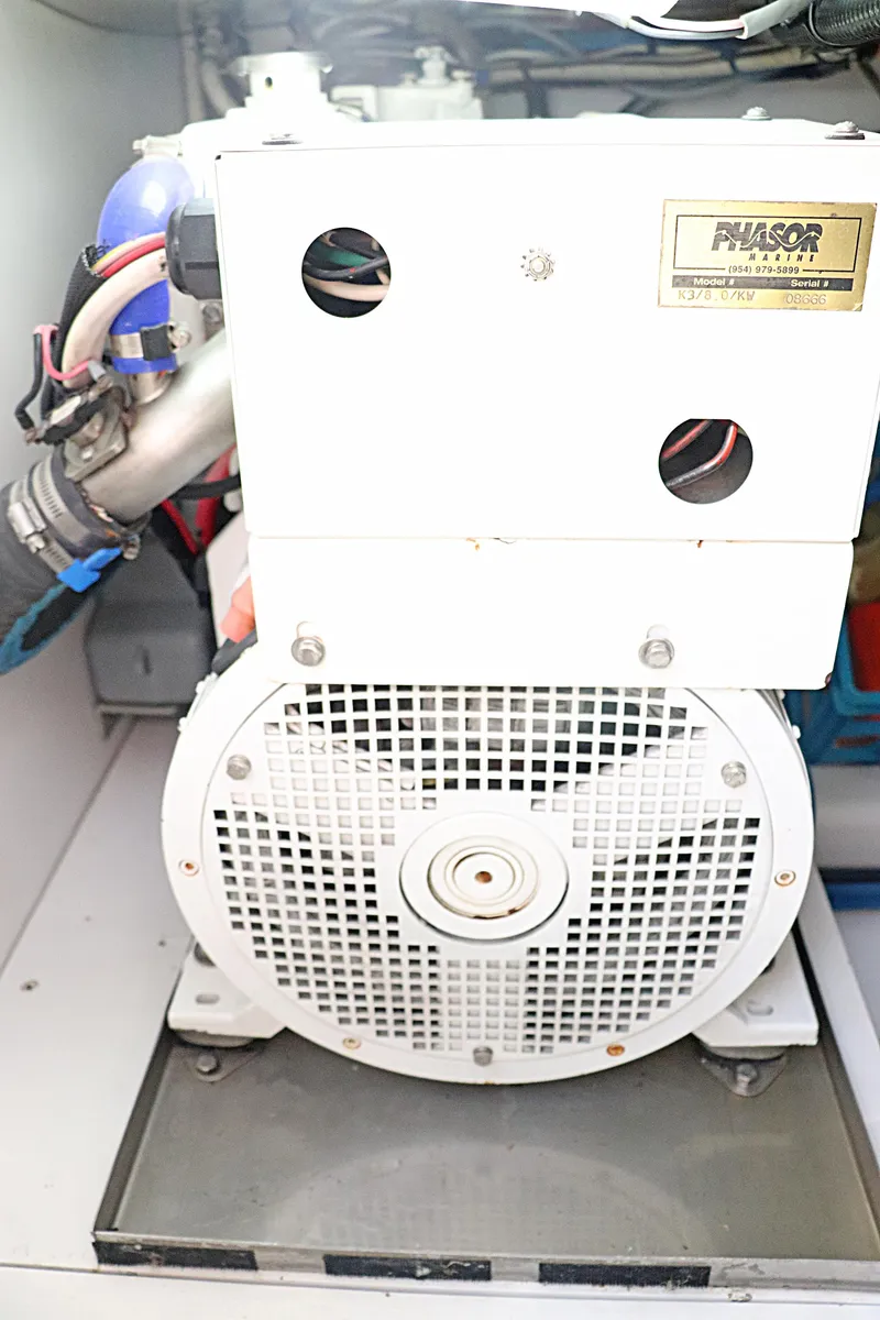 Slide: The Image of Engine compartment of 1997 Gamefisherman 34 Express boat, featuring a generator. - 39