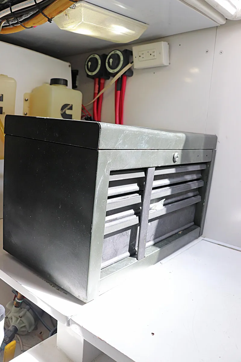 Slide: The Image of Toolbox inside 1997 Gamefisherman 34 Express boat, featuring multiple drawers and electrical components. - 42