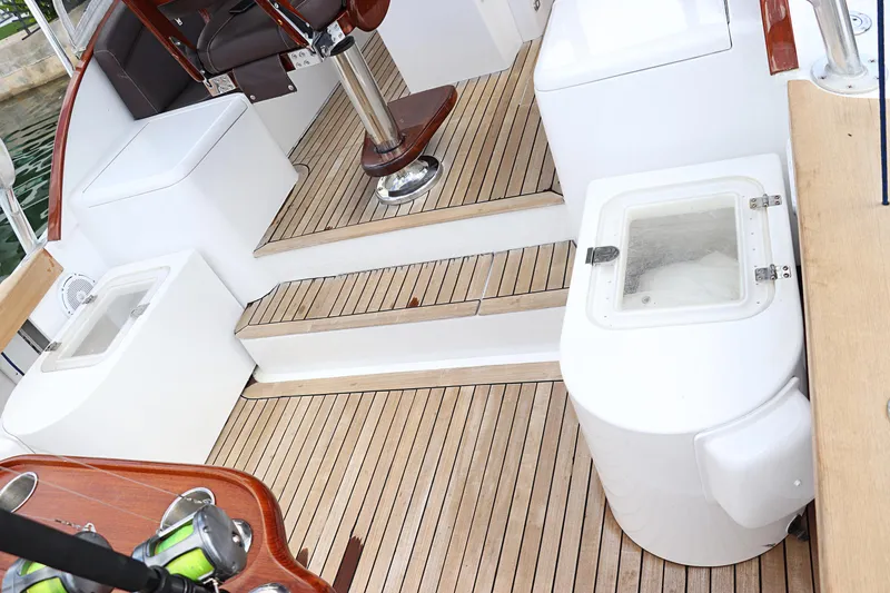 Slide: The Image of Interior of 1997 Gamefisherman 34 Express boat with wooden flooring and seating. - 46