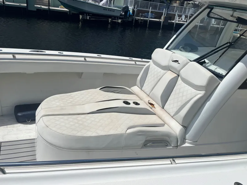 Slide: The Image of Luxurious seating on a 2018 Blackwater 43 boat, featuring elegant white upholstery. - 12
