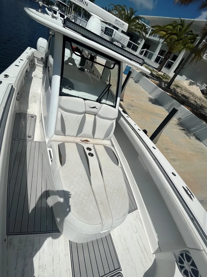 Slide: The Image of 2018 Blackwater 43 boat with sleek design docked near waterfront homes. - 15