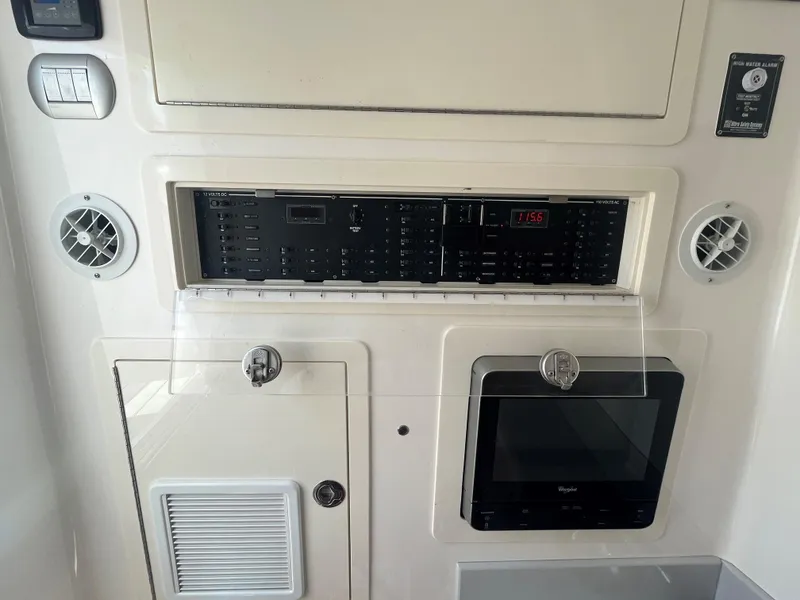 Slide: The Image of Control panel of a 2018 Blackwater 43 boat, featuring various switches and a display. - 19