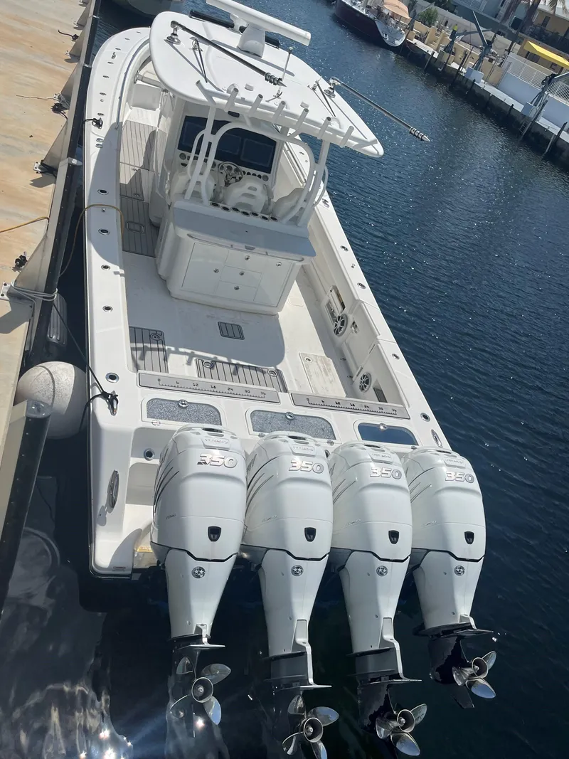 Slide: The Image of 2018 Blackwater 43 boat with four powerful outboard engines docked at marina. - 3