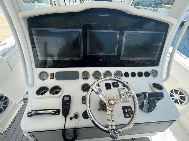 Slide: The Image of Control panel of a 2018 Blackwater 43 boat with multiple screens and gauges. - 30