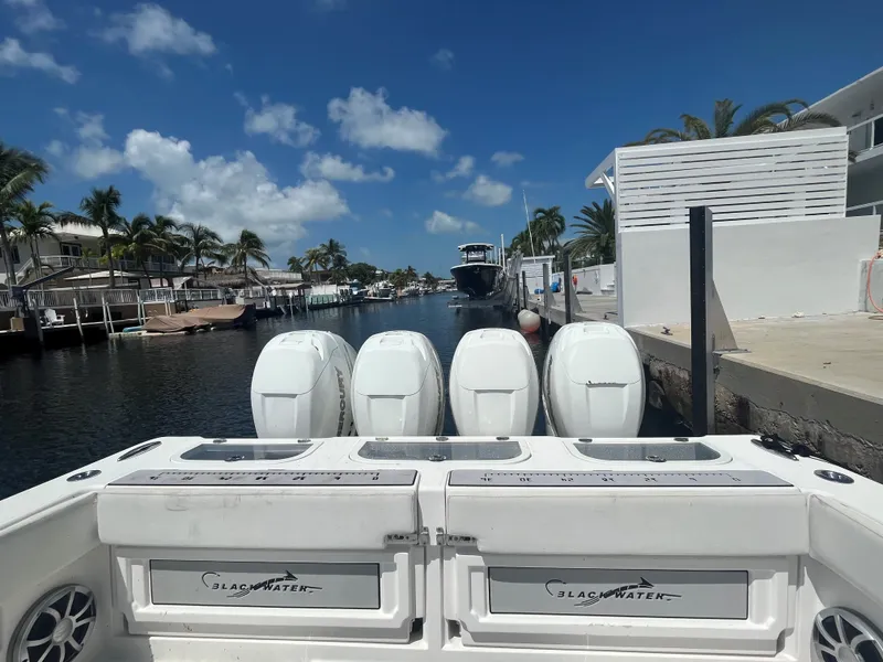 Slide: The Image of Blackwater 43 boat with four engines docked in a sunny canal, 2018 model. - 33