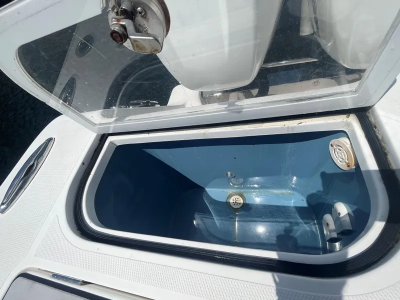 Slide: The Image of Open storage compartment on a 2018 Blackwater 43 boat, featuring a blue interior. - 34