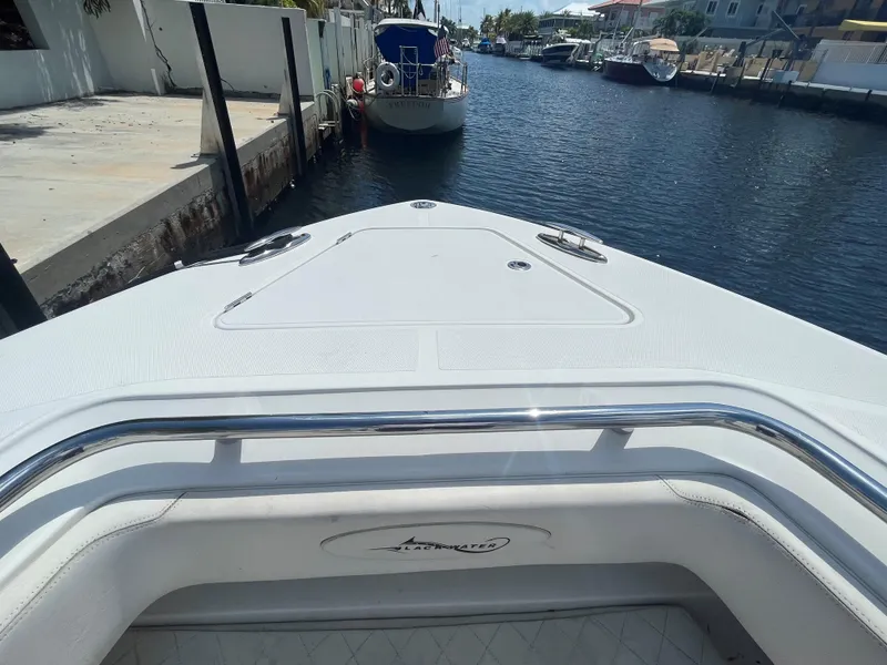Slide: The Image of Bow view of a 2018 Blackwater 43 boat docked in a canal. - 8