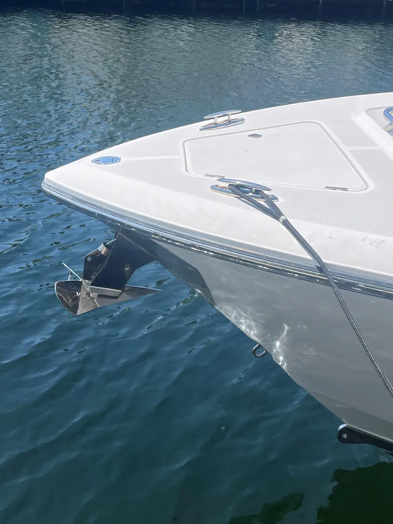 Slide: The Image of Bow of 2018 Blackwater 43 boat with anchor, docked on calm water. - 9