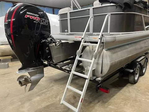 Slide: The Image of 2022 Sweetwater 2286SBCX pontoon boat with Mercury Pro XS engine on trailer. - 10