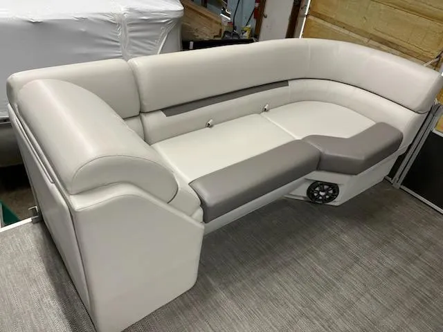 Slide: The Image of 2022 Sweetwater 2286SBCX boat seating, featuring gray and white cushioned upholstery. - 3