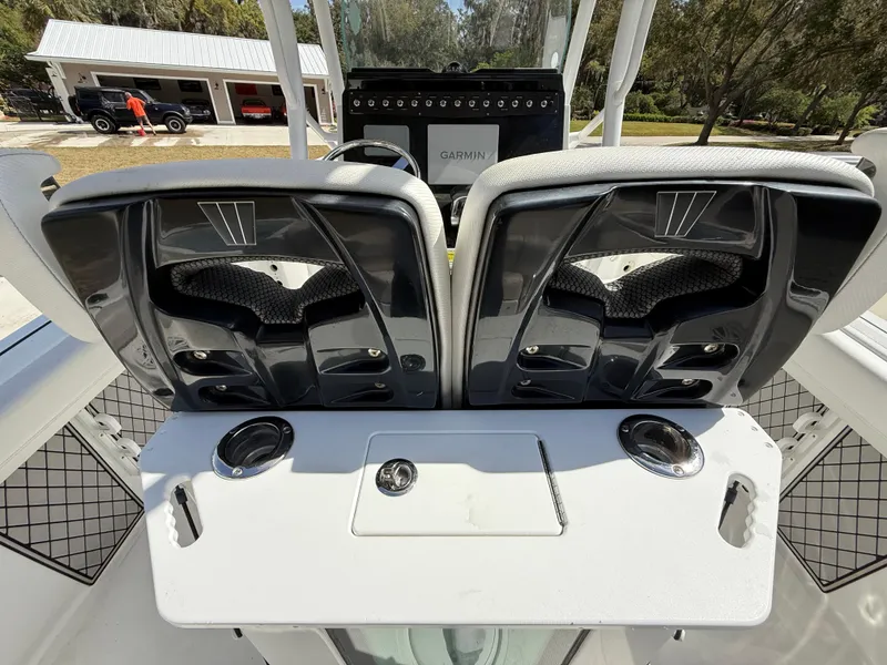 Slide: The Image of 2021 Wellcraft 242 Offshore boat interior with dual seats and Garmin navigation system. - 12