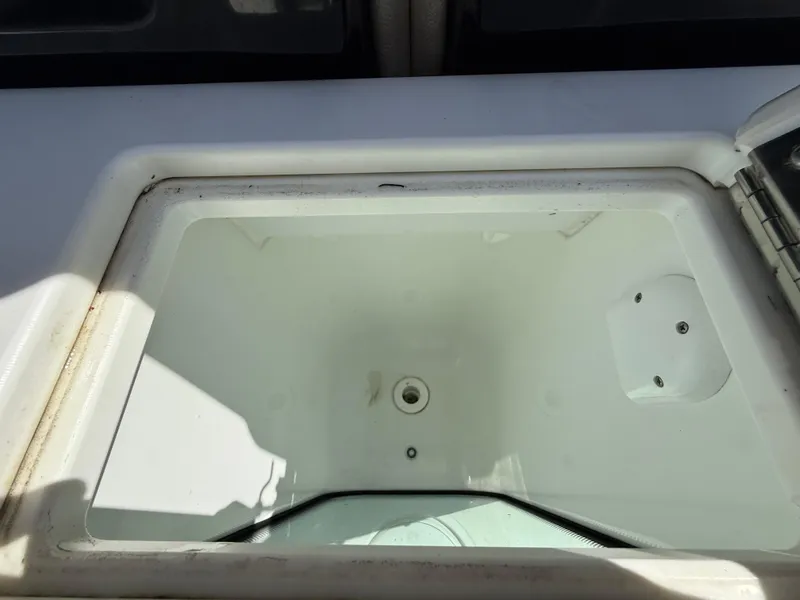 Slide: The Image of Livewell compartment on a 2021 Wellcraft 242 Offshore boat, open and empty. - 14