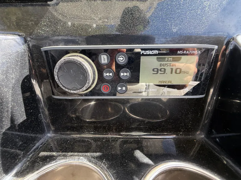 Slide: The Image of Fusion MS-RA70NSX stereo system on 2021 Wellcraft 242 Offshore boat dashboard. - 20