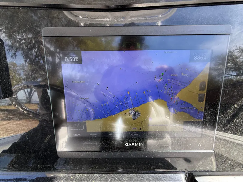 Slide: The Image of Garmin navigation display on 2021 Wellcraft 242 Offshore boat, showing nautical map. - 21