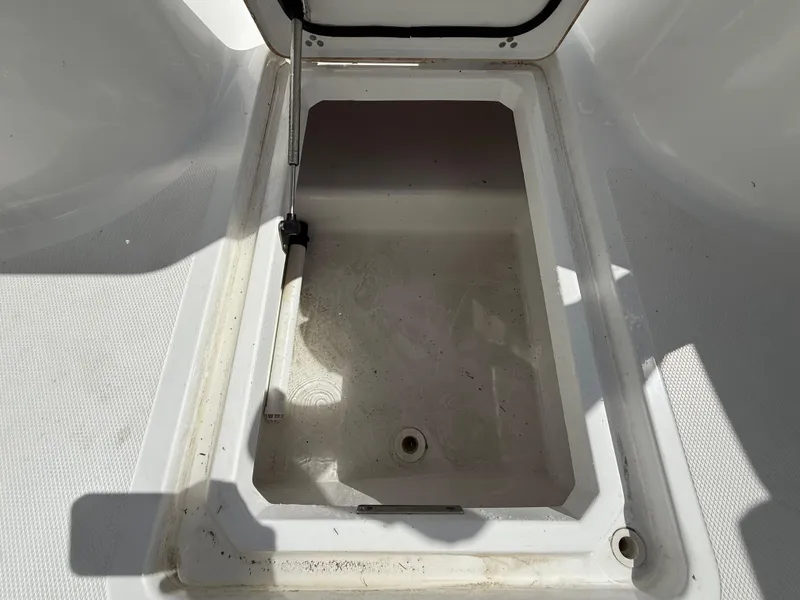 Slide: The Image of Storage compartment on 2021 Wellcraft 242 Offshore boat, open and empty. - 26