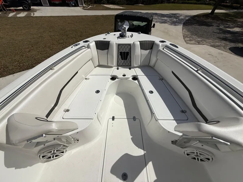 Slide: The Image of 2021 Wellcraft 242 Offshore boat interior with spacious seating and modern design. - 27