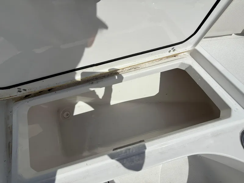 Slide: The Image of Open storage compartment on a 2021 Wellcraft 242 Offshore boat. - 29