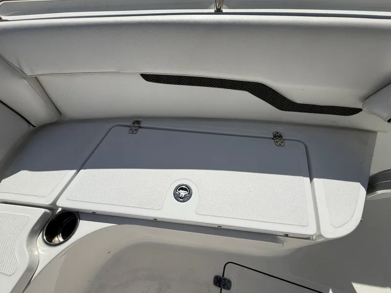 Slide: The Image of 2021 Wellcraft 242 Offshore boat interior seating and storage compartment. - 30