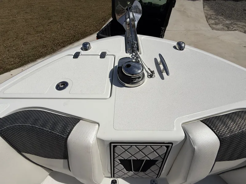 Slide: The Image of 2021 Wellcraft 242 Offshore boat deck with anchor and storage compartments. - 35