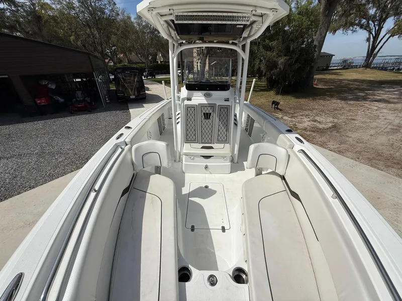 Slide: The Image of 2021 Wellcraft 242 Offshore boat interior with spacious seating and modern design. - 38